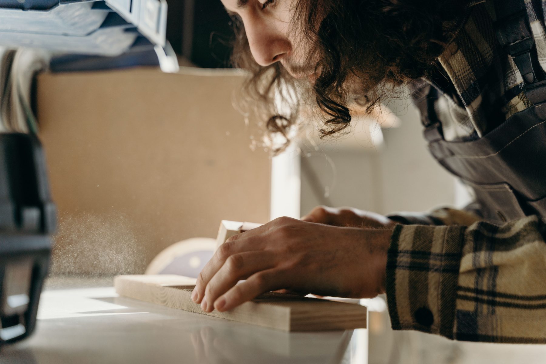 Craftsman finishing a mattress